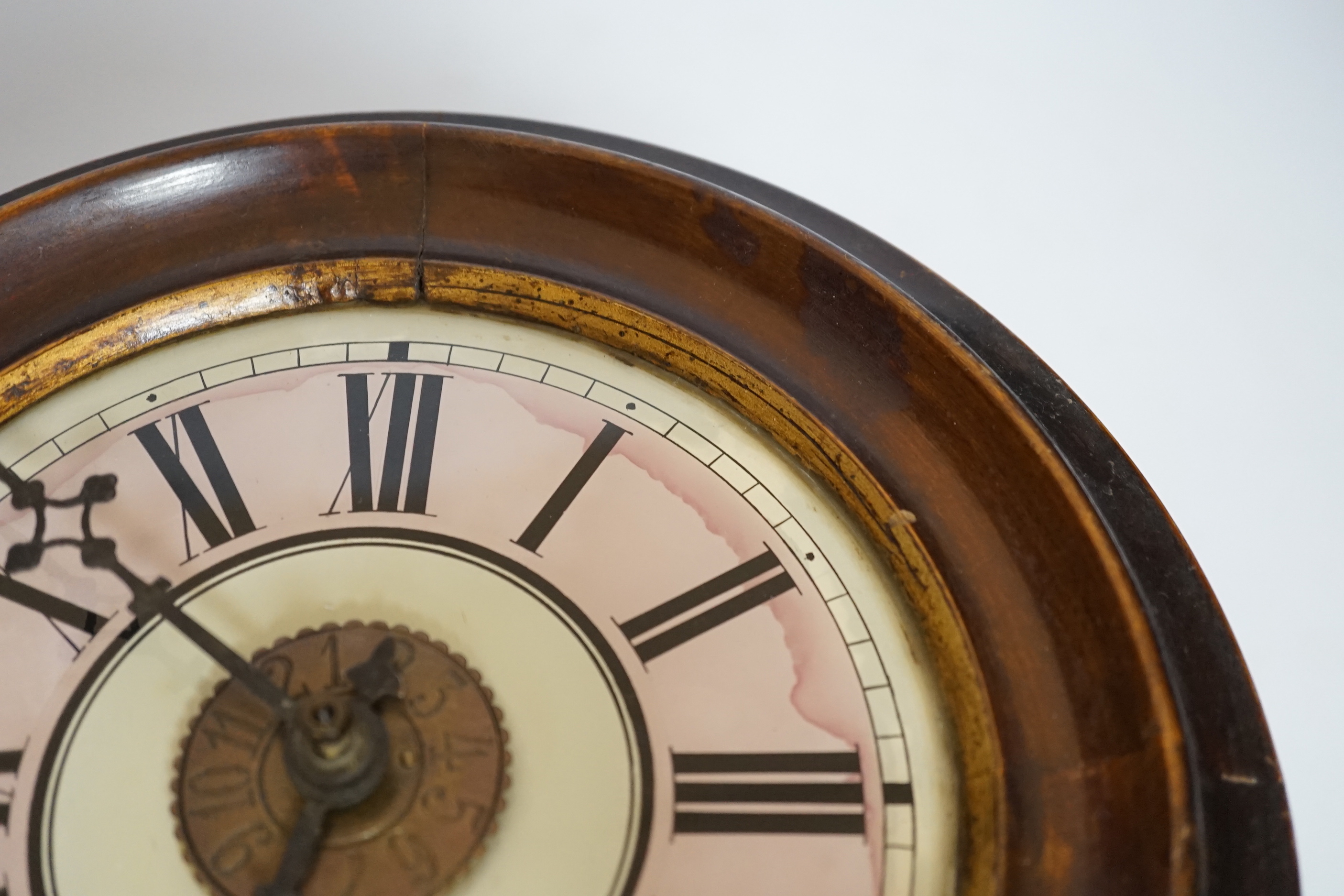 An antique postman's alarm clock with pendulum and weights, 27cm